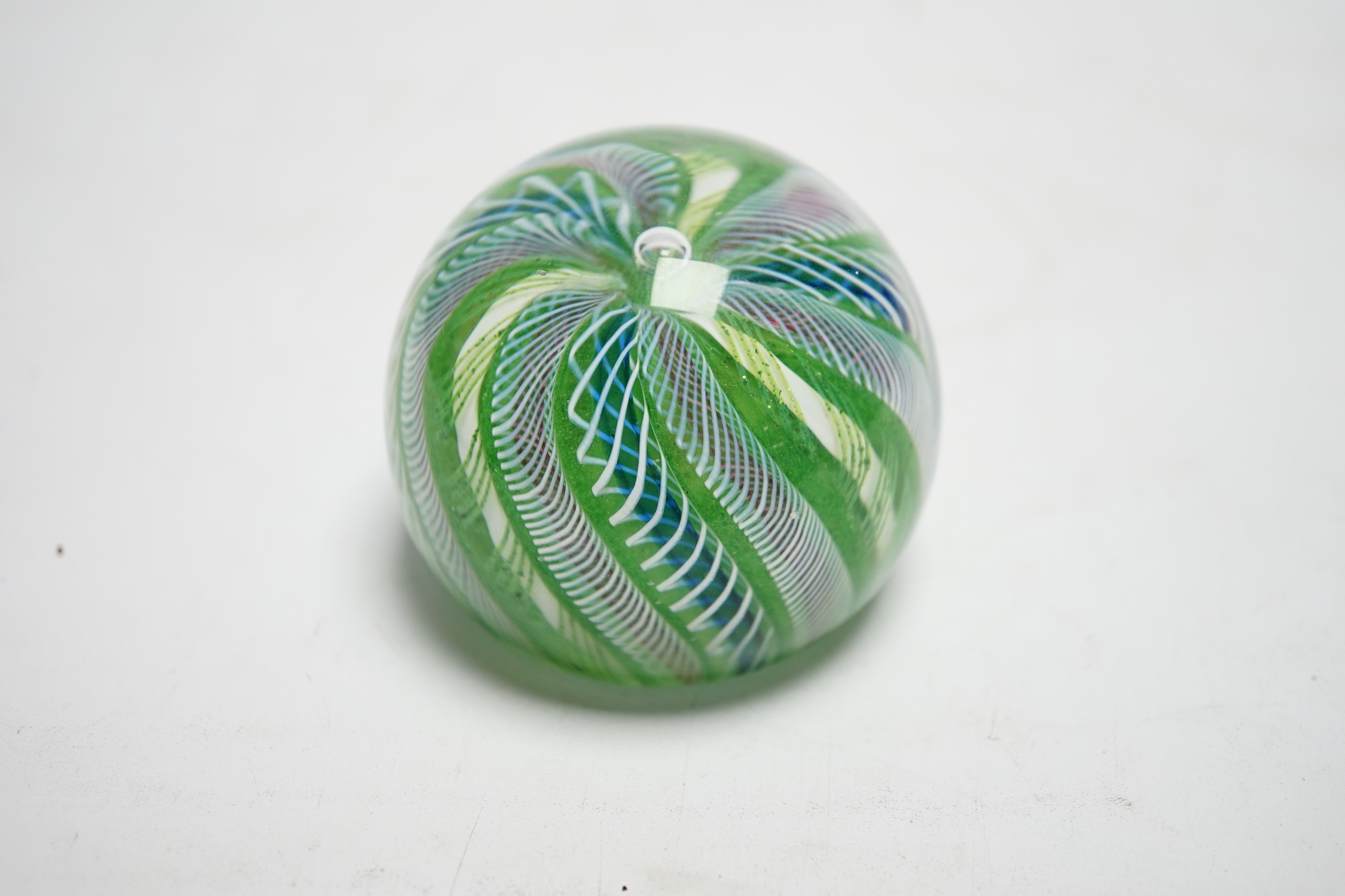 A Paul Ysart latticino swirl crown paperweight, polished concave base, Caithness period, 6.5cm